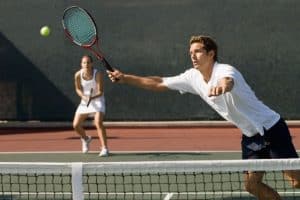 playing on net doubles tennis